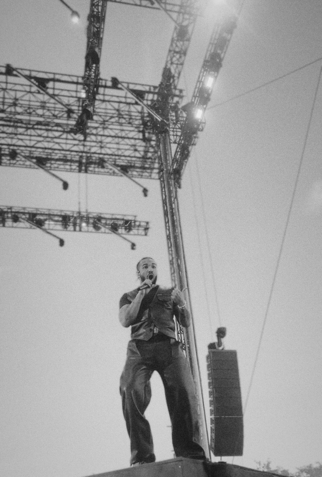Black and white shot of Drake singing on the Wireless festival stage